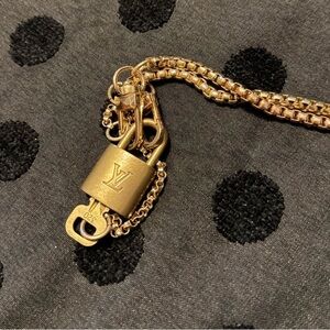 Louis Vuitton brass lock & key with necklace